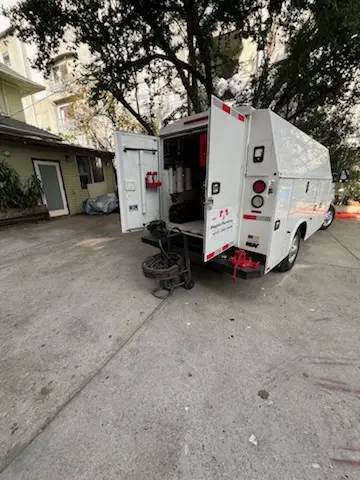 Magnet Plumbing service vehicle on-site for Grease Trap Cleaning in Zephyrhills West